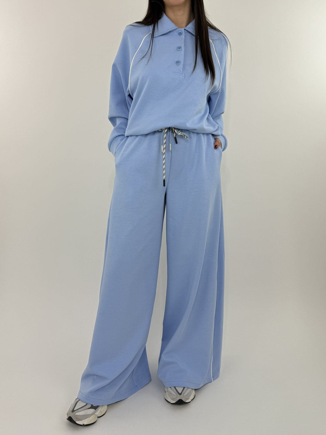 Felpa polo azzurra con riga