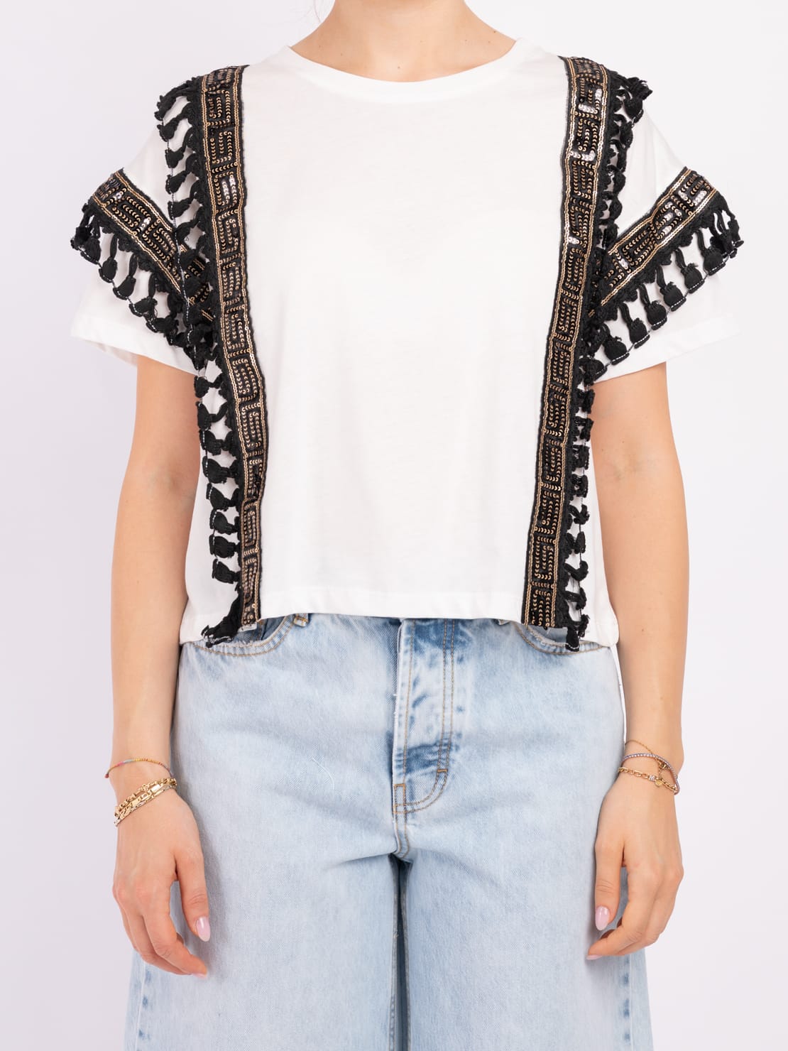 Maglia decorazione nappine oro