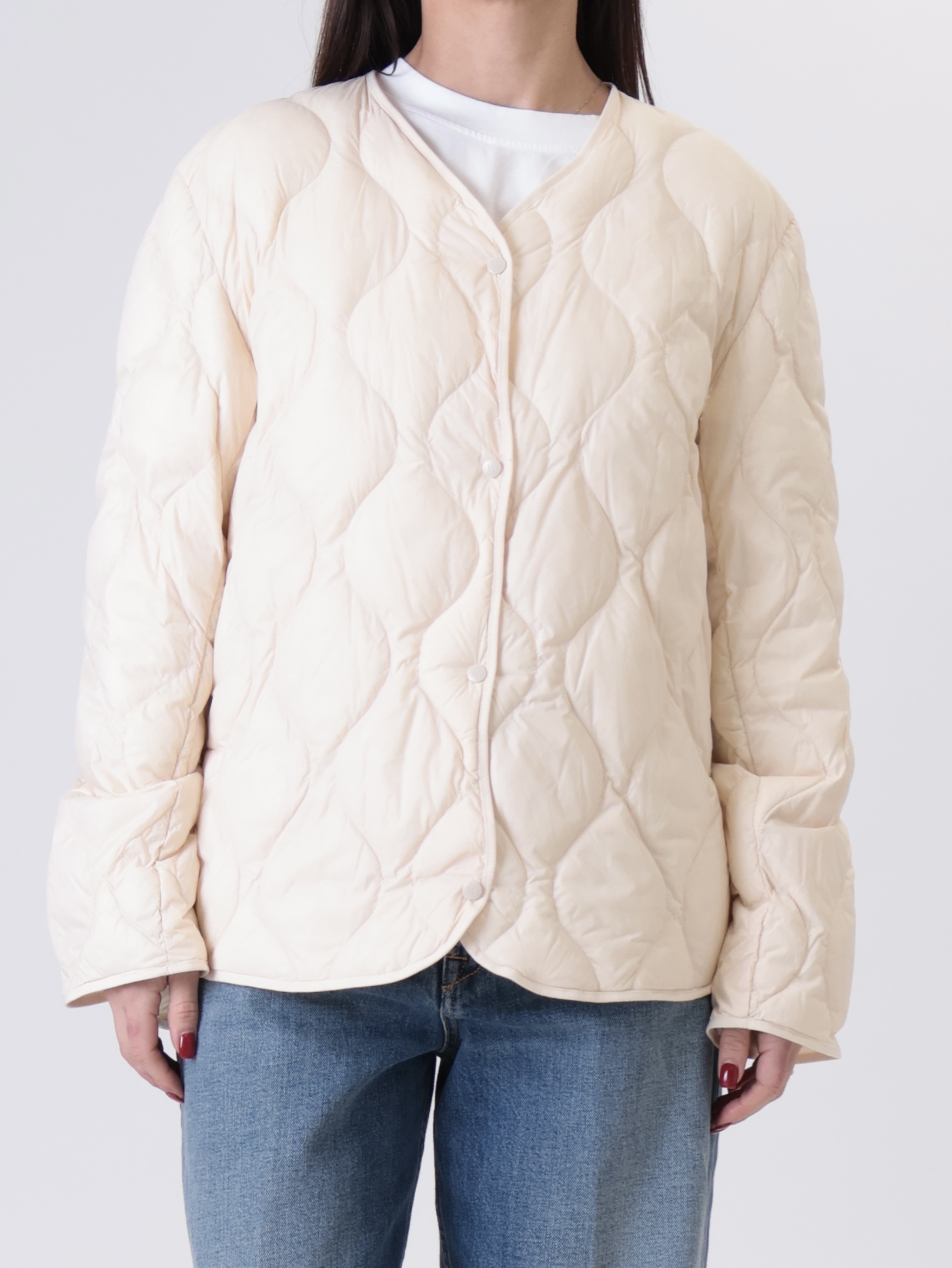 Piumino con impunture panna