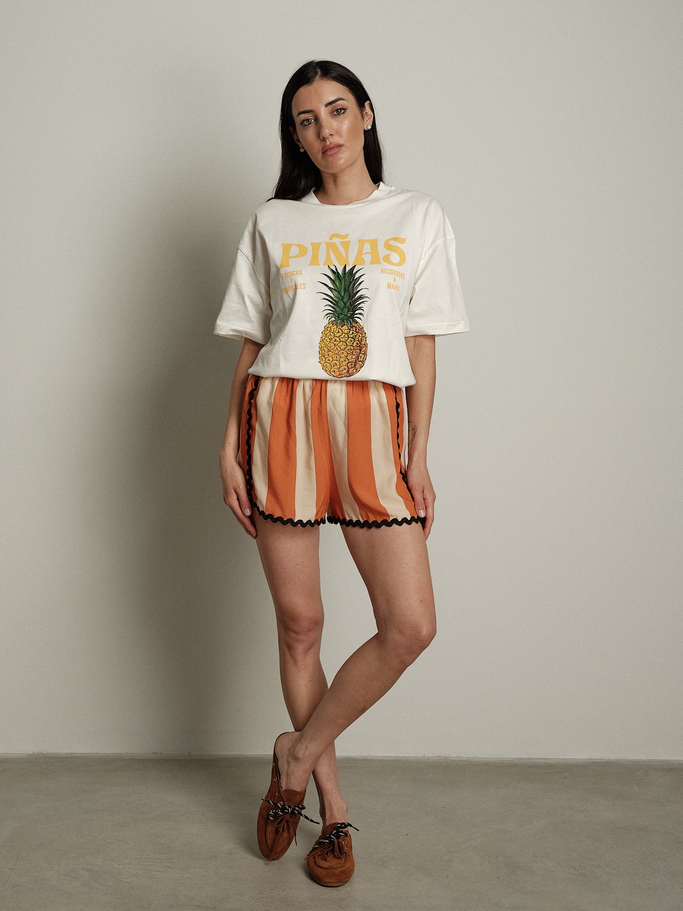 Shorts righe  arancio orli neri